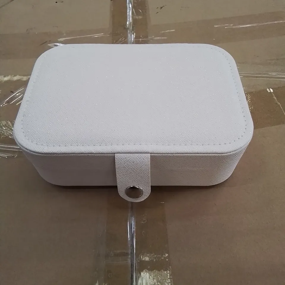 A BOX OF APPROXIMATELY 50 VANITY CASES IN WHITE WITH GLITTER EFFECT