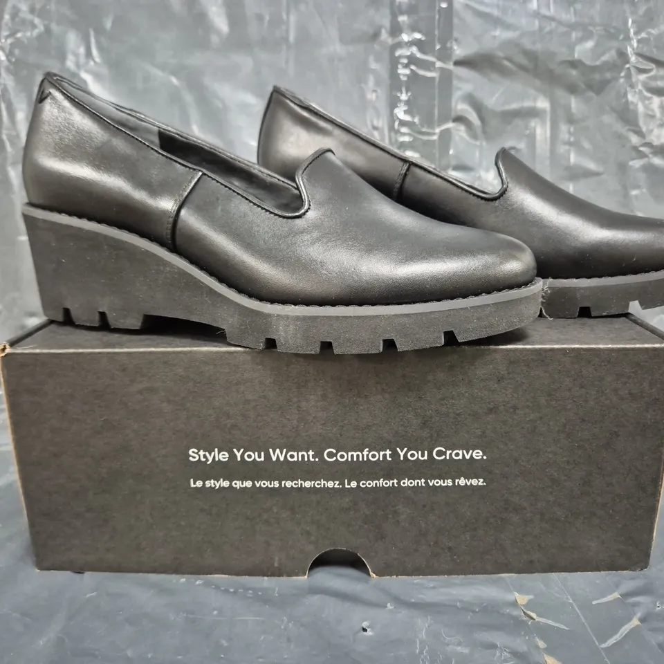 BOXED PAIR OF VIONIC WEDGE SLIP ON SHOES IN BLACK SIZE 6