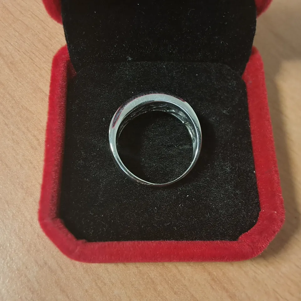 18CT WHITE GOLD WAVE RING SET WITH NATURAL DIAMONDS