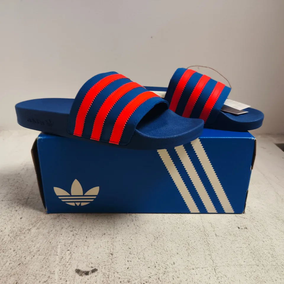 BOXED PAIR OF ADIDAS ADILETTE SLIDES IN BLUE/ORANGE SIZE UK 9