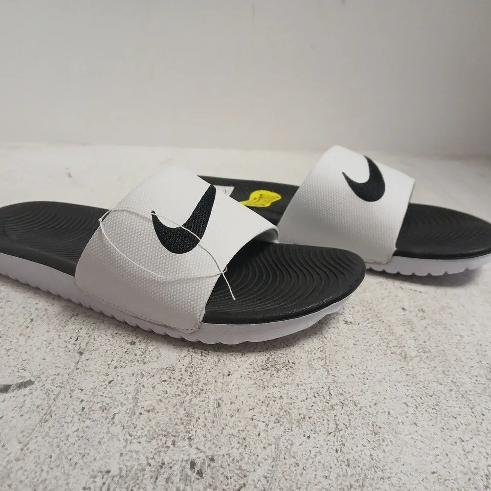 BOXED PAIR OF NIKE KAWA SLIDES IN WHITE/BLACK SIZE UK 5.5
