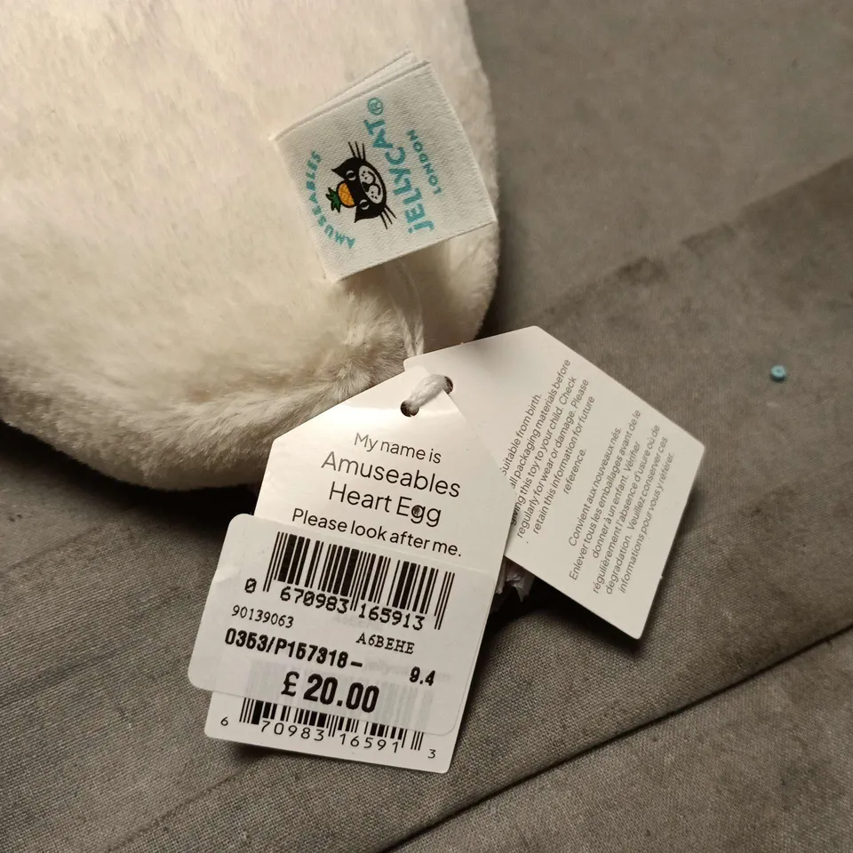 JELLYCAT AMUSEABLES HEART EGG SOFT TOY IN WHITE WITH YELLOW FACE