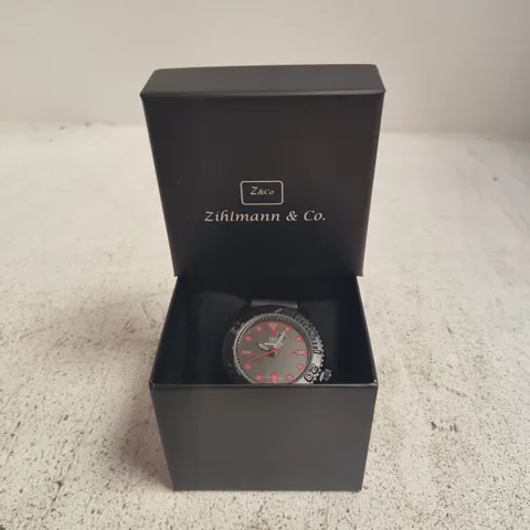 ZIHLMANN & CO. WRISTWATCH, BOXED – BLACK DIAL WITH RED NUMERALS