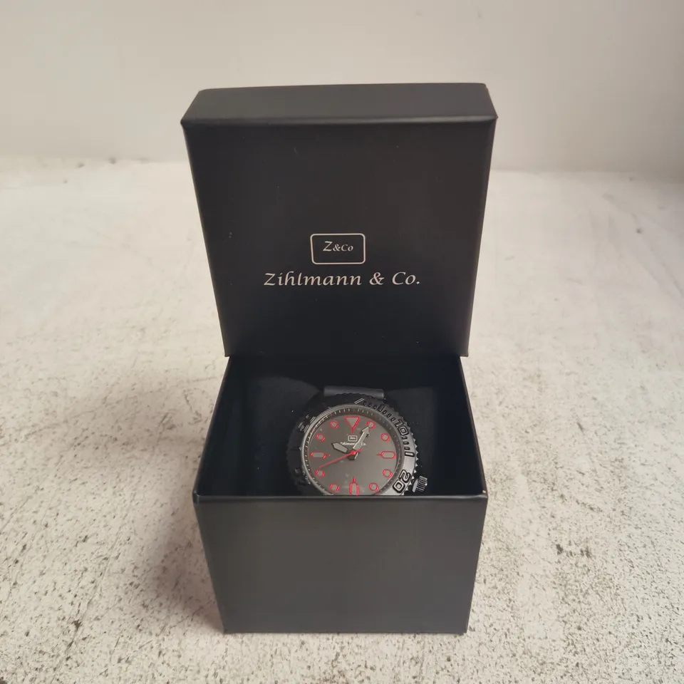 ZIHLMANN & CO. WRISTWATCH, BOXED – BLACK DIAL WITH RED NUMERALS