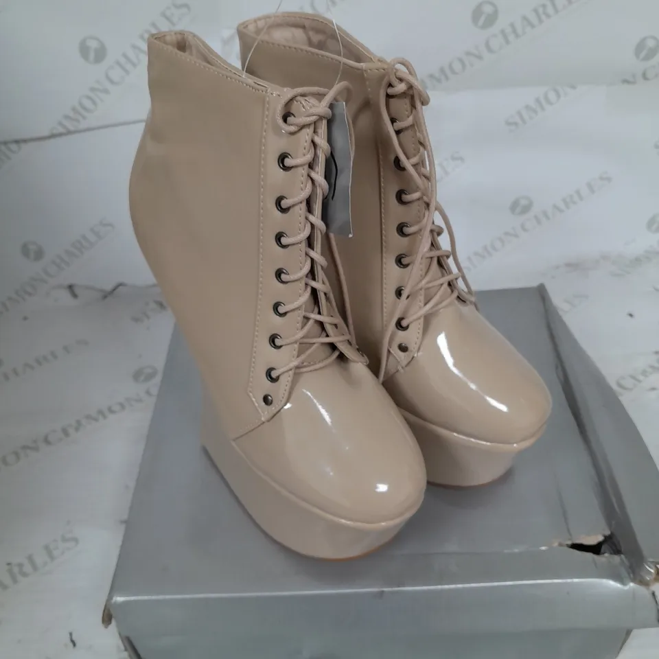 BOXED PAIR OF CASANDRA PLATFORM LACE UP ANKLE BOOT IN NUDE PATENT SIZE 5