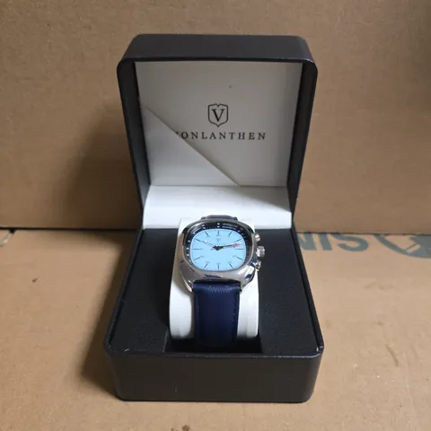 VONLANTHEN STAINLESS STEEL WRISTWATCH WITH LIGHT BLUE FACE & NAVY LEATHER STRAP