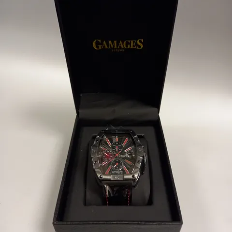 BOXED GAMAGES GALACTIC BLACK TRIPLE DATE DIAL RED STRIPE AUTOMATIC LEATHER STRAP WRISTWATCH	