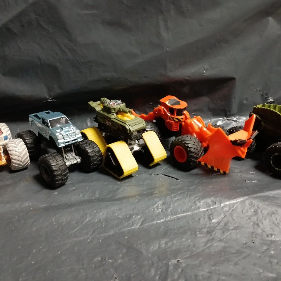 APPROXIMATELY 10 ASSORTED MONSTER TRUCK TOYS