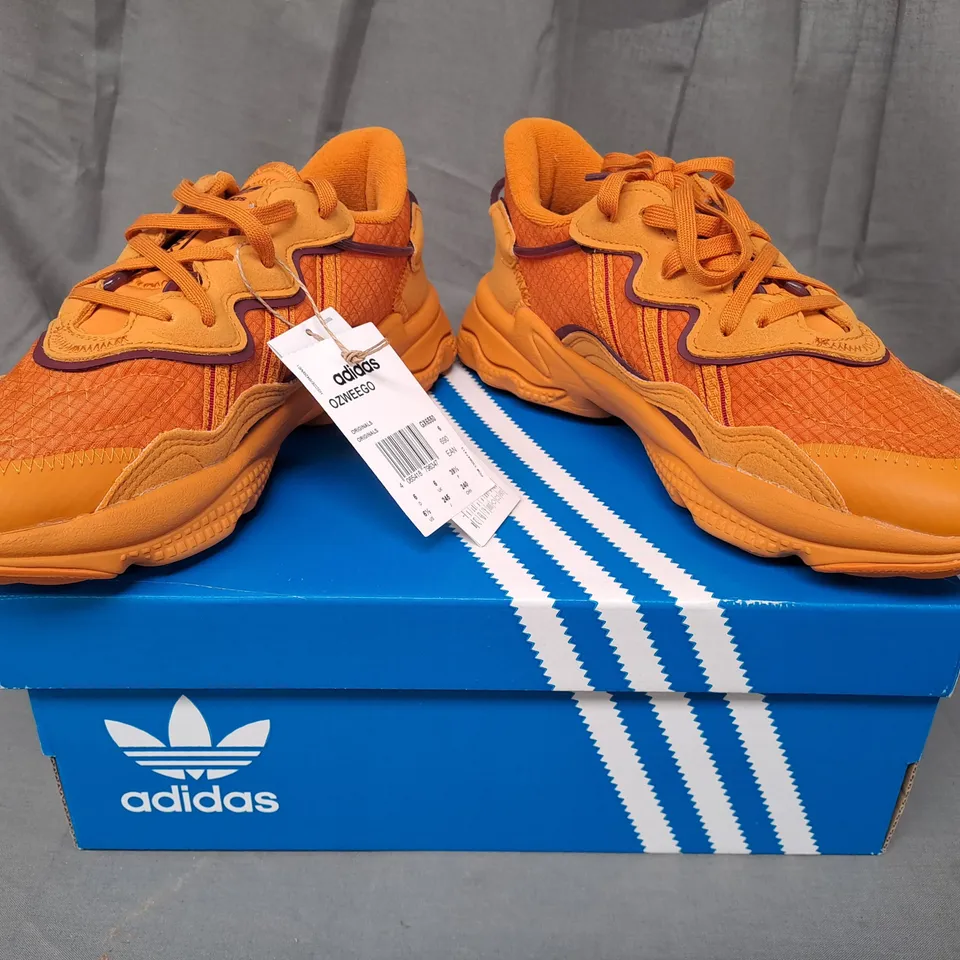 BOXED PAIR OF ADIDAS OZWEEGO SHOES IN ORANGE UK SIZE 6