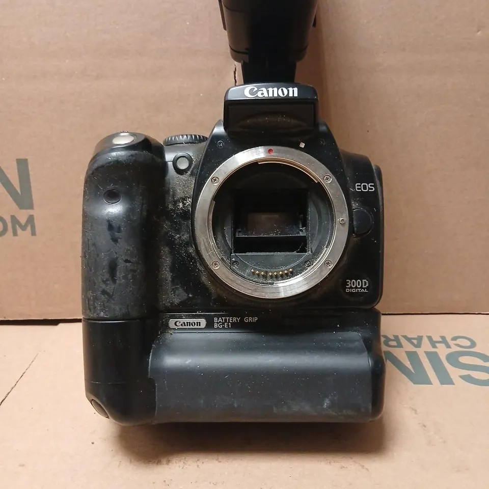 CANON EOS 300D DIGITAL SLR WITH BG-E1 BATTERY GRIP AND SUNPAK AUTO 28SR FLASH