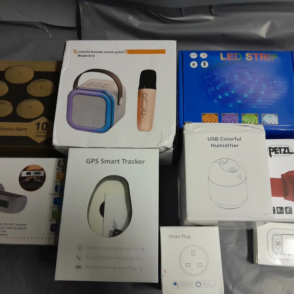 LOT OF 13 ASSORTED ITEMS TO INCLUDE SMART PLUG, LED STRIP LIGHT, KAROKE SYSTEM AND GPS SMART TRACKER