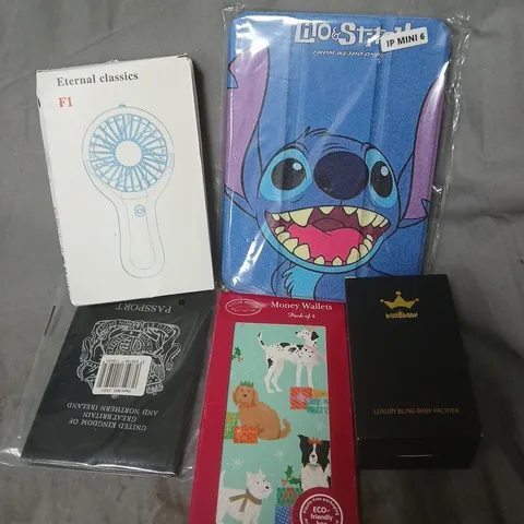 APPROXIMATELY 15 ASSORTED HOUSEHOLD ITEMS TO INCLUDE PORTABLE FAN, MONEY WALLETS, LUXURY BLING BABY PATCHER, ETC