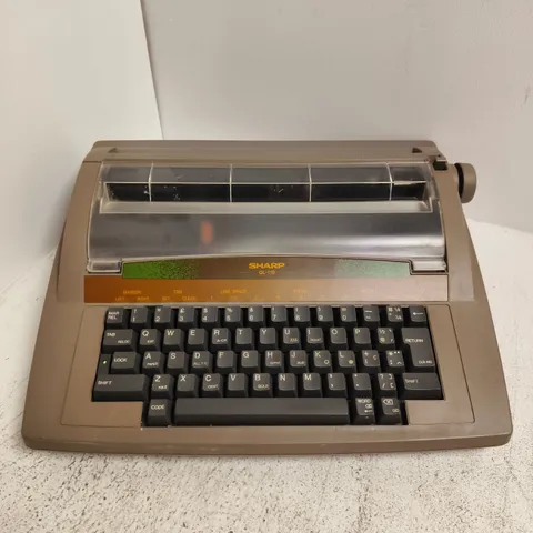 SHARP QL-110 VINTAGE PORTABLE ELECTRONIC TYPEWRITER AND WORD PROCESSOR