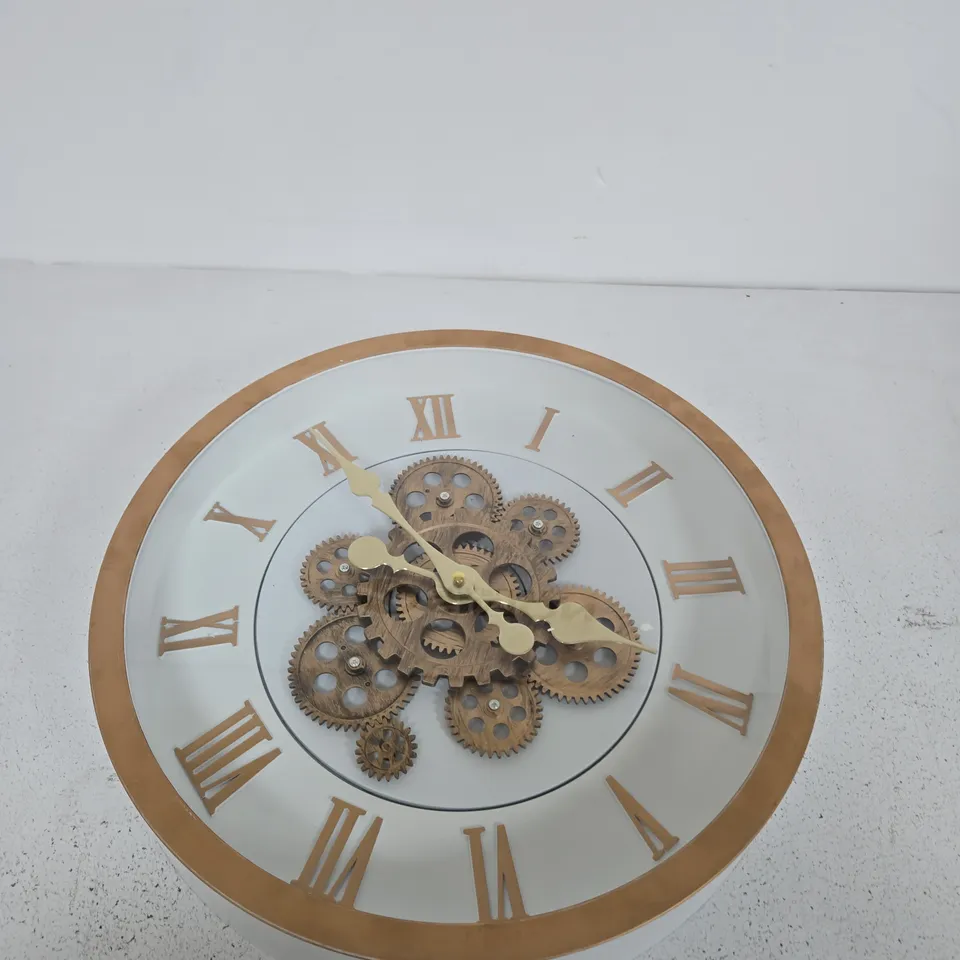 DECORATIVE ROUND WALL CLOCK WITH EXPOSED BRASS GEARS AND ROMAN NUMERALS