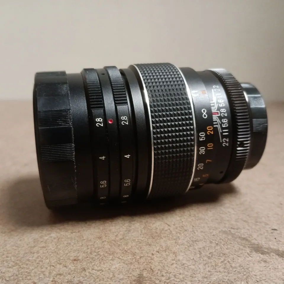 VINTAGE CAMERA LENS WITH BLACK LEATHER CASE
