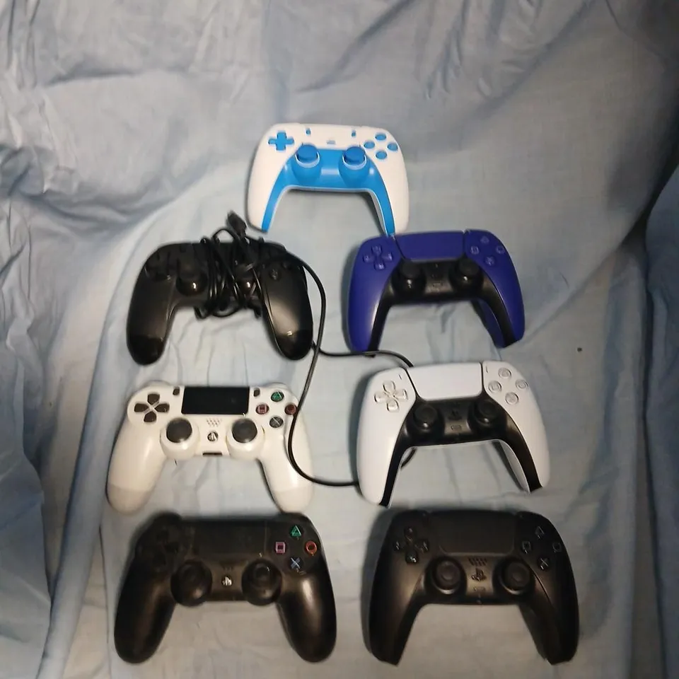 SEVEN ASSORTED CONTROLLERS FOR VARIOUS PLAYSTATIONS