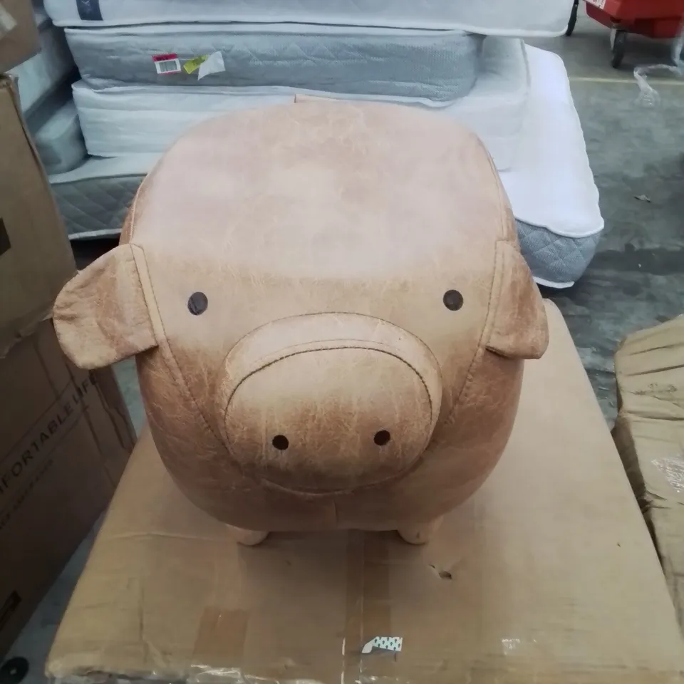 A FAUX LEATHER UPHOLSTERED PIGGY POUFFE 