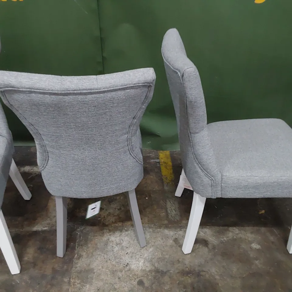 THREE UPHOLSTERED BUTTONED BACK DINING CHAIRS GREY FABRIC ( ODD LEG COLOUR)