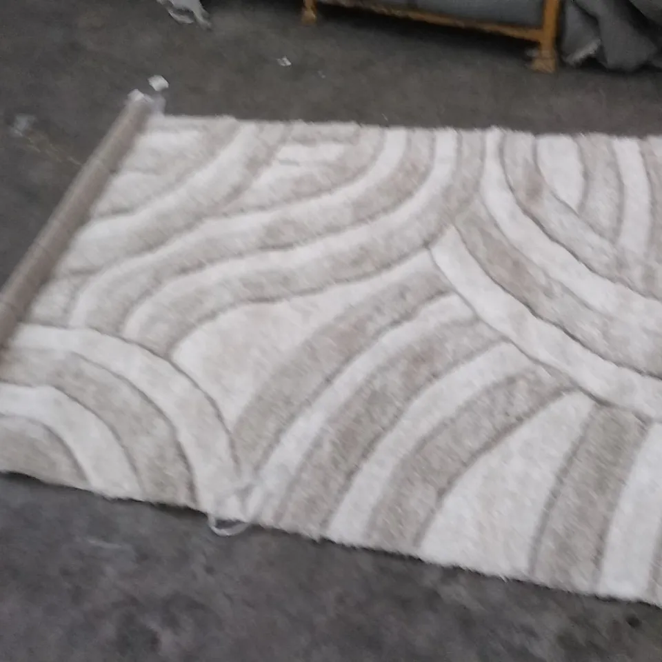STILLAGE OF APPROXIMATELY 12 DESIGNER RUGS