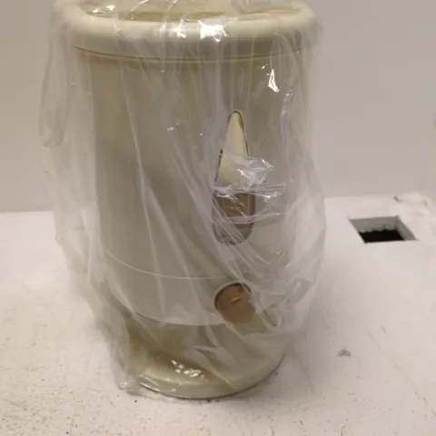 CREAM DISPENSERβ WRAPPED IN PROTECTIVE PLASTIC