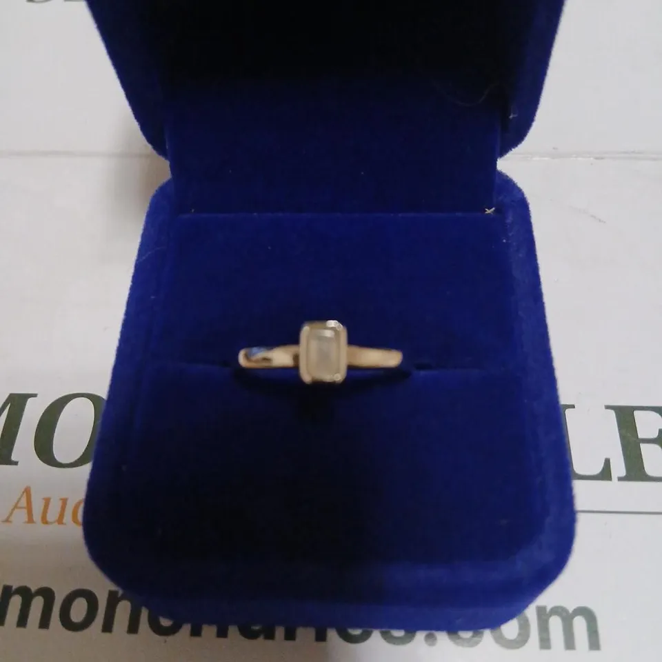 SILVER RING WITH PALE RECTANGULAR GEMSTONE 