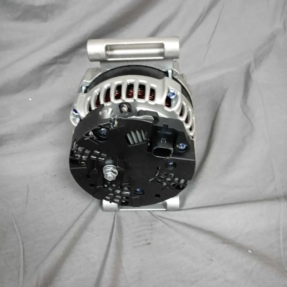 Used automotive alternator with pulley and mounting bracket