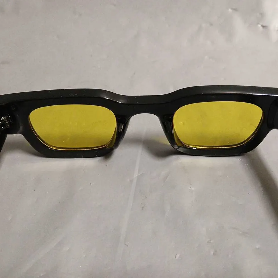 BOXED PAIR OF EYEKONIK BLACK FRAMED GLASSES WITH YELLOW TINT LENS