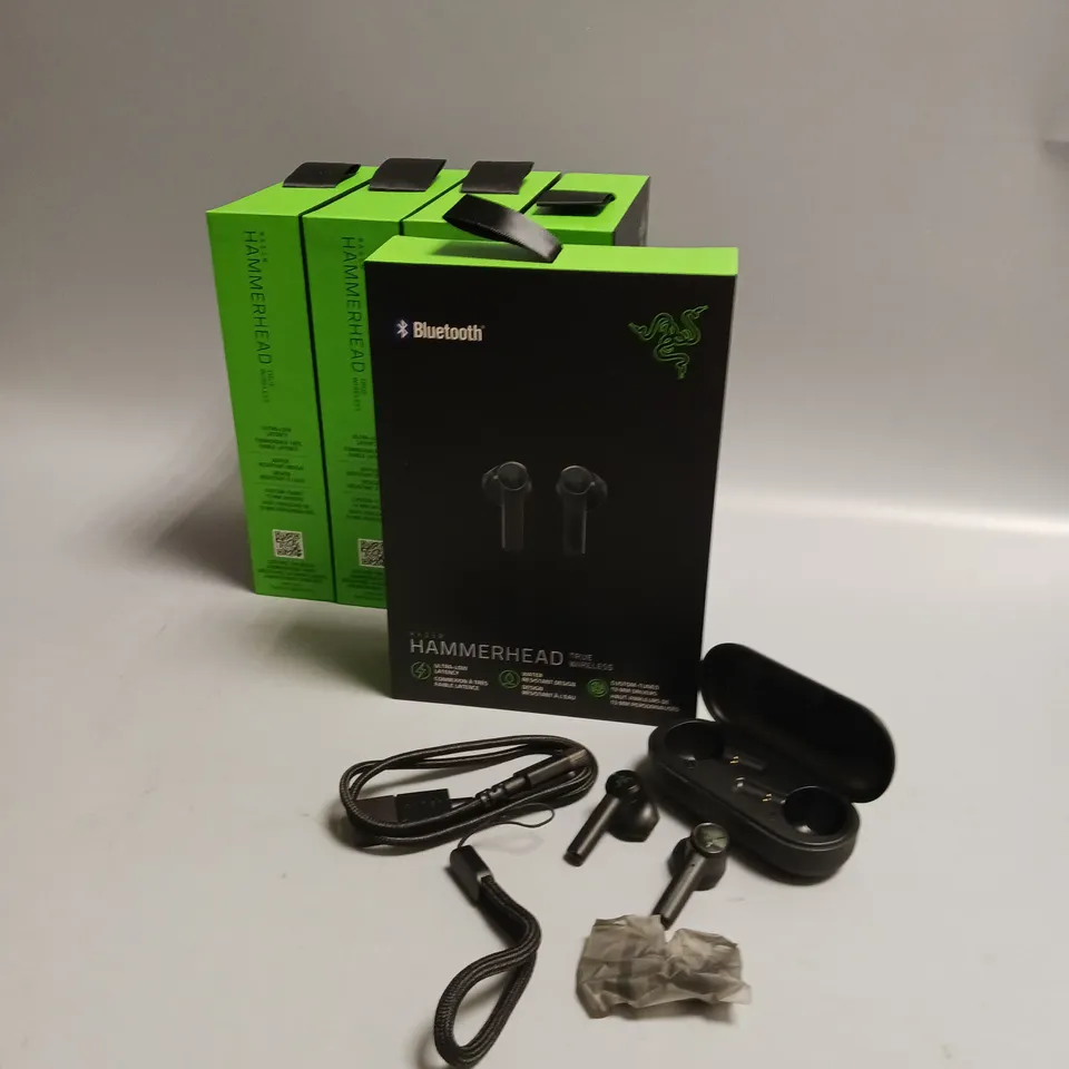 LOT OF 5 BOXED RAZER WIRELESS HEADPHONES IN BLACK AND GREEN INCLUDES CHARGING CASE, CABLE AND WRIST STRAP