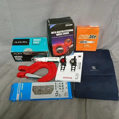 APPROXIMATELY 9 ASSORTED VEHICLE PARTS & ACCESSORIES TO INCLUDE HEATED STEERING WHEEL COVER, AUTOLITE COPPER, SHIMANO CHAIN, ETC