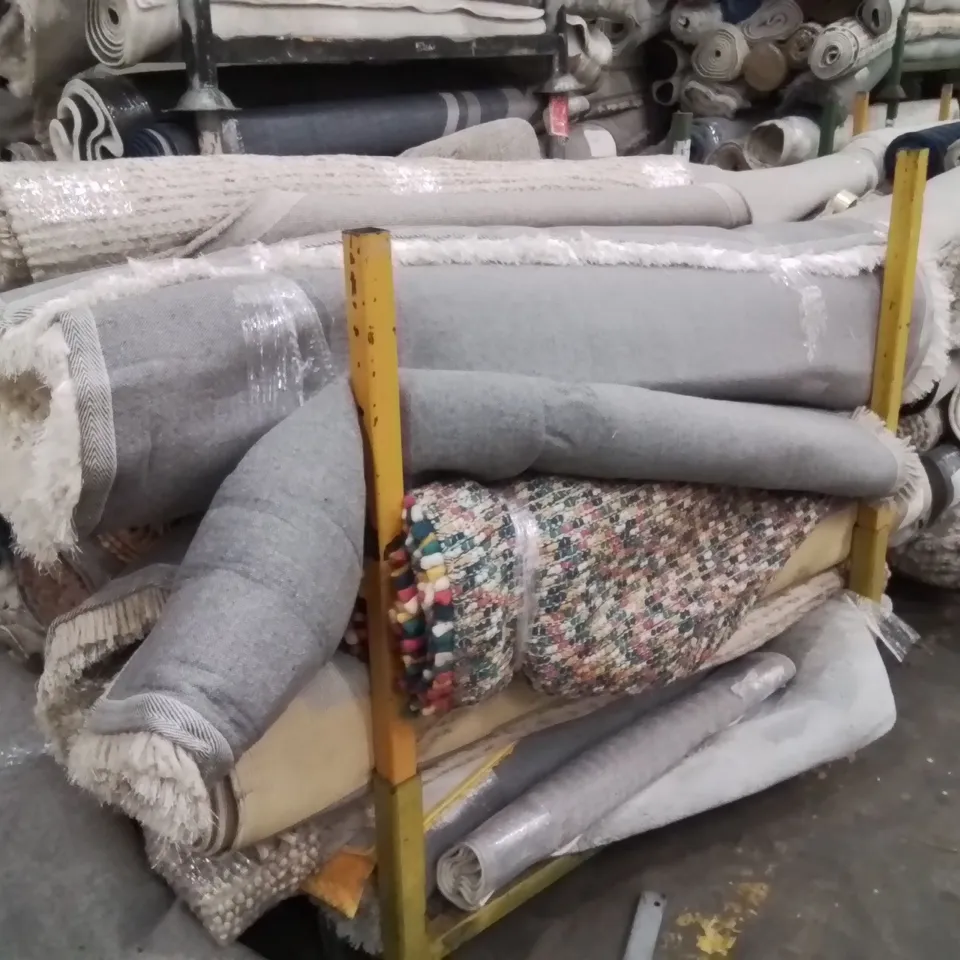 STILLAGE OF APPROXIMATELY 20 QUALITY DESIGNER RUGS