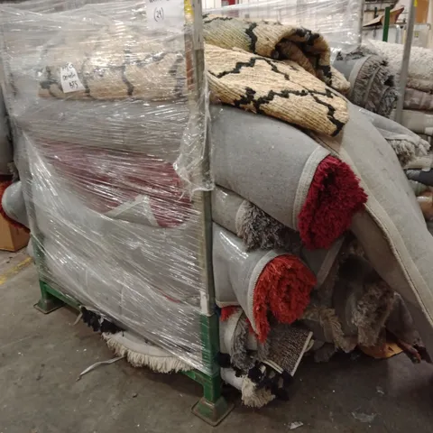 STILLAGE OF APPROXIMATELY 20 DESIGNER RUGS
