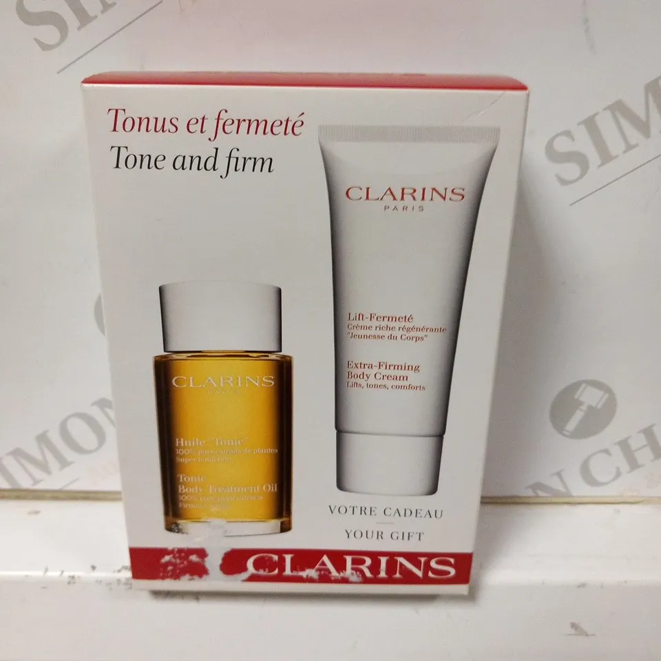 5 BOXED CLARINS PARIS TONE AND FIRM GIFT SETS