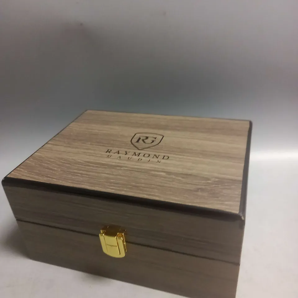 BOXED RAYMOND GAUDIN WATCH IN BLUE/GOLD/SILVER