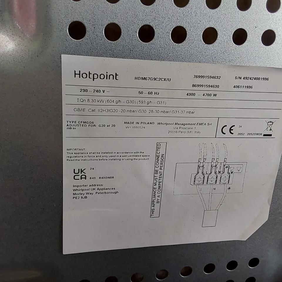 HOTPOINT DOUBLE OVEN AND GAS HOBS IN BLACK AND SILVER HANDLES 