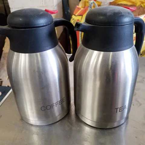 SET OF 2 VACUUM PUSH BUTTON INSCRIBED JUGS