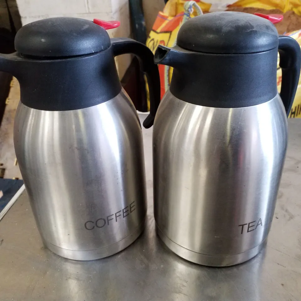 SET OF 2 VACUUM PUSH BUTTON INSCRIBED JUGS