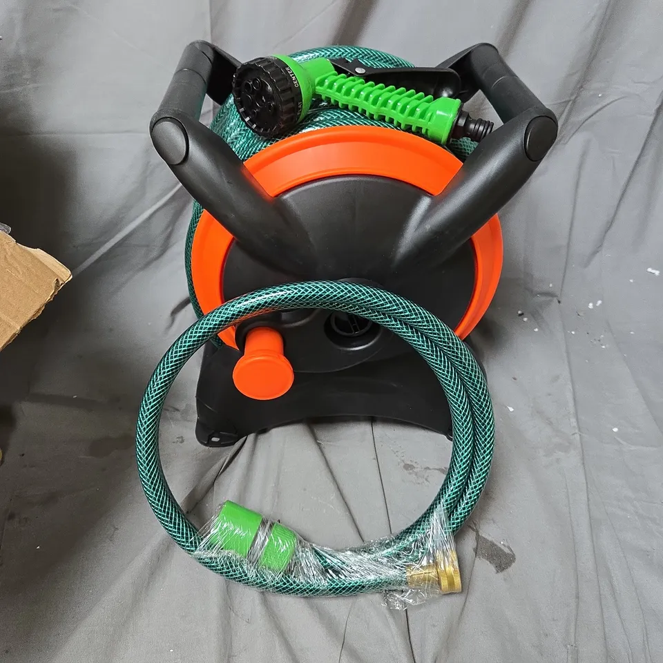 GARDEN HOSE REEL WITH GREEN HOSE AND SPRAY NOZZLE