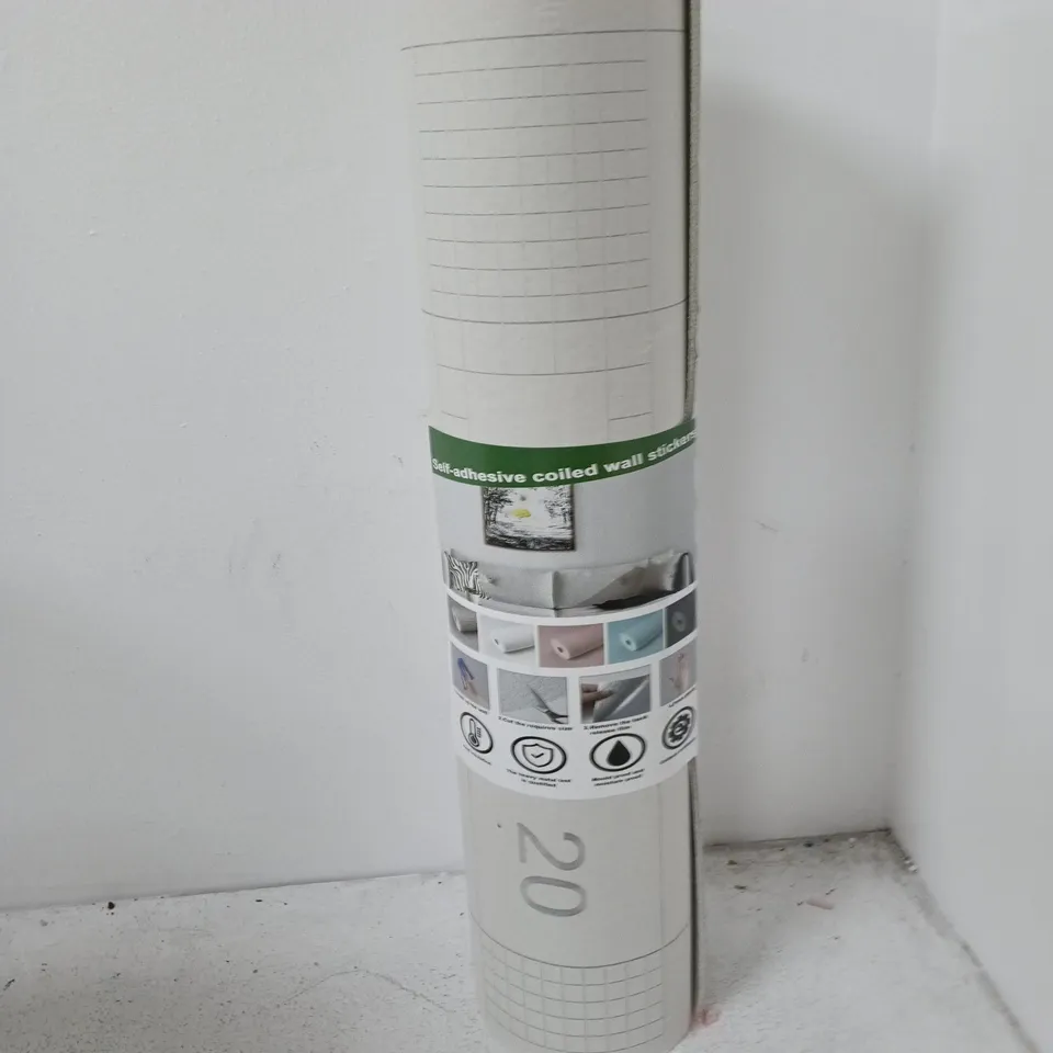 BOX CONTAINING APPROXIMATELY 7 ROLLS OF SELF ADHESIVE COILED WALL STICKERS. SOME NEW SOME ALREADY USED.