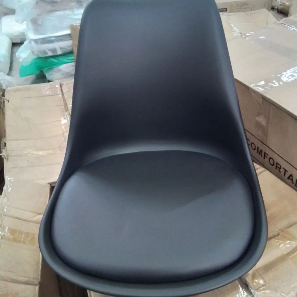 A BOXED BLACK UPHOLSTERED OFFICE CHAIR 