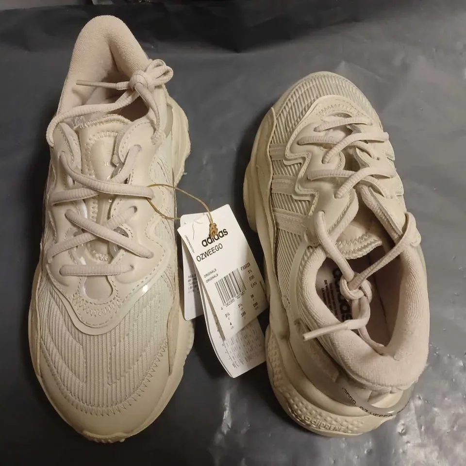 ADIDAS OZWEEGO TRAINERS IN CREAM - UK 3.5