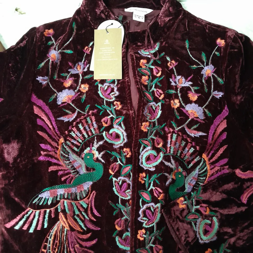 A BOX OF 10 CLOTHING ITEMS TO INCLUDE A PURPLE TOP A BROWN PAIR OF STRETCHY TROUSERS AND A ORIENTAL STYLE VELVET EFFECT JACKET WITH PEACOCK DESIGN 