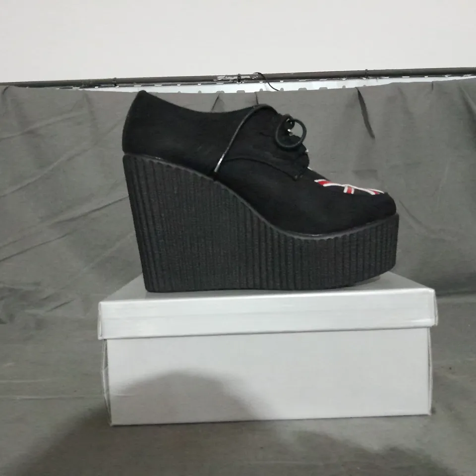 APPROXIMATELY 13 BOXED PAIR OF CASANDRA WEDGE PLATFORM SHOES IN BLACK SUEDE UK FLAG VARIOUS SIZES TO INCLUDE SIZE 6
