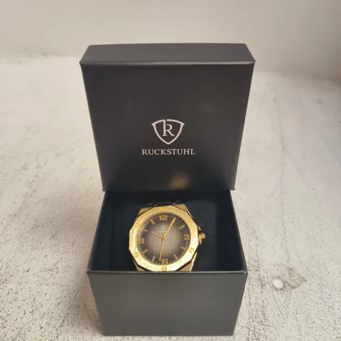 RUCKSTUHL GOLD-TONE WRISTWATCH – BLACK DIAL, RUBBER STRAP