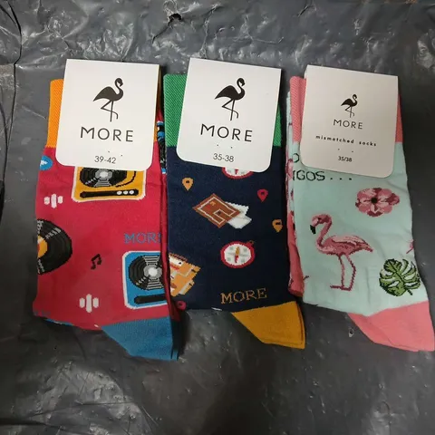 APPROXIMATELY 50 ASSORTED MORE BRANDED SOCKS IN VARIOUS SIZES AND COLOURS