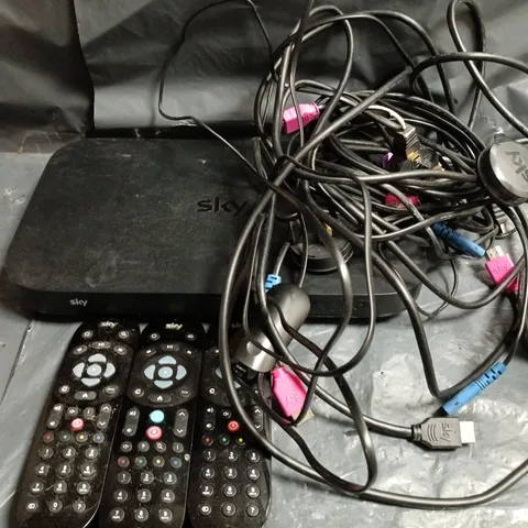 APPROXIMATELY 20 ASSORTED HOUSEHOLD ITEMS TO INCLUDE SKY BOX, REMOTE CONTROLS AND ASSORTED WIRES AND CABLES