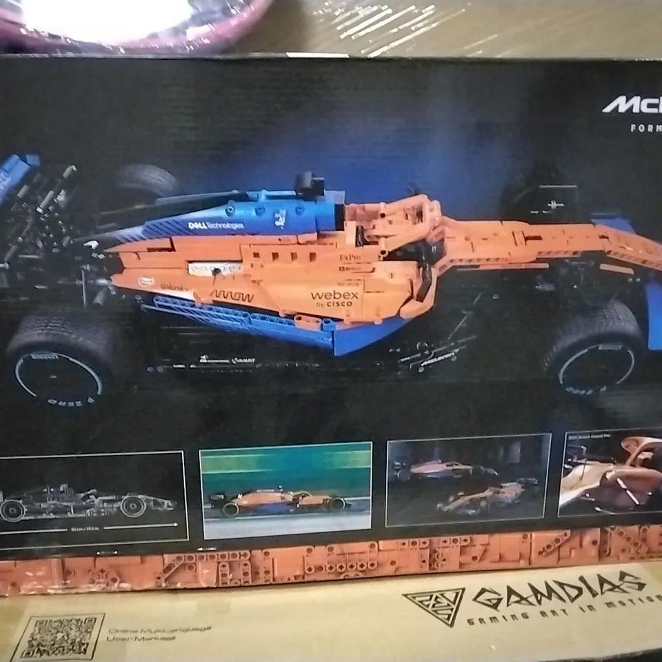 PALLET CONTAINING VARIOUS ASSORTED ITEMS TO INCLUDE: LOGO MCLAREN F1 CAR, FOOT MASSAGERS GAMING PC CASE, GAMING MOUSE MAT ETC.