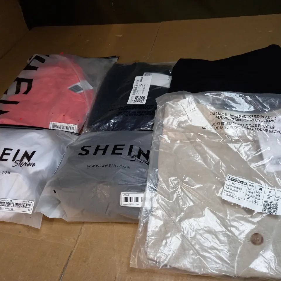 LARGE BOX OF ASSORTED CLOTHING ITEMS TOO INCLUDE TOPS , DRESSES AND PANTS ALL IN VARIOUS SIZES AND COLOURS 