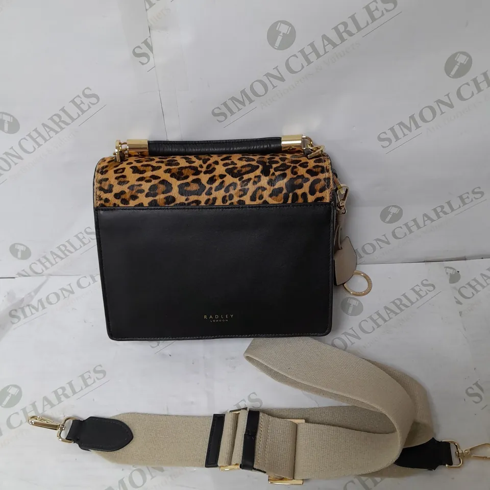 RADLEY LONDON FUR FINISH HANDBAG IN LEOPARD PRINT AND BLACK WITH BEIGE CROSSBODY STRAP AND GOLD DETAILS