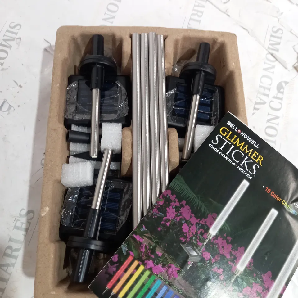 BOXED BELL & HOWELL GLIMMER STICKS SET OF 4 SOLAR PATHWAY LIGHTS