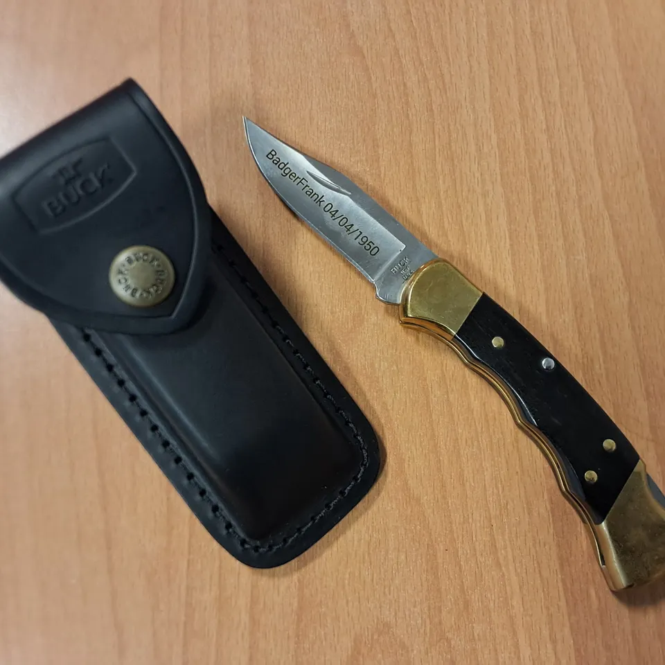 BUCK FOLDING KNIFE WITH SHEATH IN BLACK/GOLD